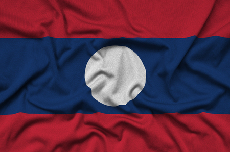 Laos flag  is depicted on a sports cloth fabric with many folds. Sport team waving bannerの写真素材