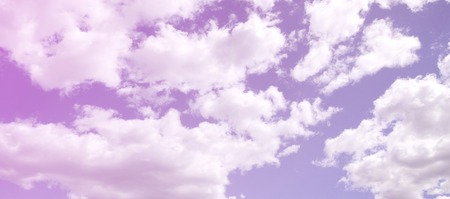 A blue sky with lots of white clouds of different sizes
