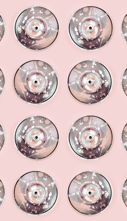 Many used spray cans for graffiti drawing lies on a pastel colored backgroung. Street art painting concept. Minimal flat lay pattern. Top viewの写真素材