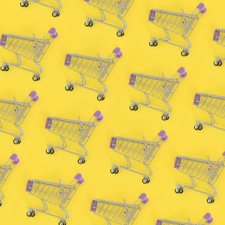 Shopping addiction, shopping lover or shopaholic concept. Many small empty shopping carts perform a...