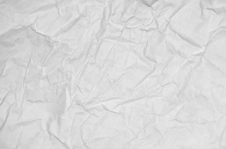 White crumpled paper blank background surface. Pastels book cover paint top view; Gray grunge surface empty parchment sheet. Art poster above folds angle craft focus light sceneの写真素材