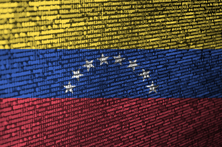 Venezuela flag  is depicted on the screen with the program code. The concept of modern technology and site development.の写真素材