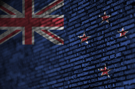 New Zealand flag  is depicted on the screen with the program code. The concept of modern technology and site development.の写真素材