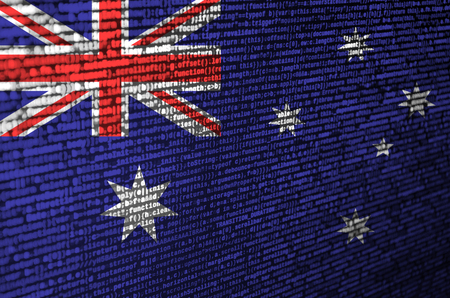 Australia flag  is depicted on the screen with the program code. The concept of modern technology and site development.の写真素材