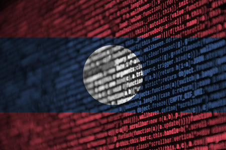 Laos flag  is depicted on the screen with the program code. The concept of modern technology and site development.の写真素材