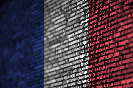 France flag  is depicted on the screen with the program code. The concept of modern technology and site development.の写真素材