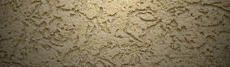 The texture of the beige decorative plaster in bark beetle style. Russian variation of decorating...