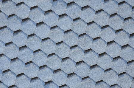 Modern roofing and decoration of chimneys. Flexible bitumen or slate shingles in hexagon shape. Top view textureの写真素材