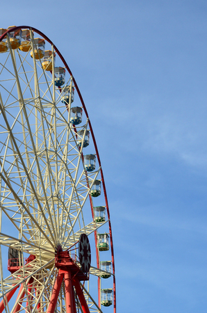 Entertainment Ferris wheel against the clear blue sky in sunny dayの写真素材