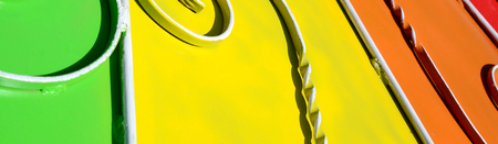 Metal texture of a piece of colored wall with a forged pattern. Rainbow colorsの写真素材