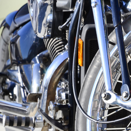 Close up fragment of chromed shiny wheel of old classic motorbikeの写真素材