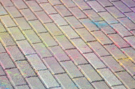 Multi colored earth, paving slabs, powder coated with dry colors at the Holi festival close upの写真素材