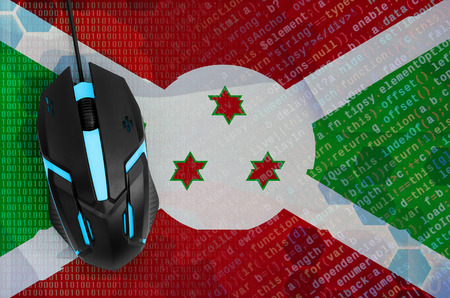 Burundi flag  and modern backlit computer mouse. The concept of digital threat, illegal actions on the Internetの写真素材