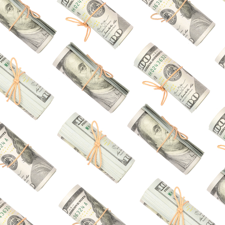 Several bundles of US dollars isolated on white background. Minimalistic composition and business conceptの写真素材