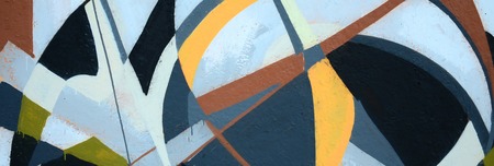 Fragment of colored street art graffiti paintings with contours and shading close up. Background texture of youth contemporary art culture. Grey and orange colorsのeditorial素材