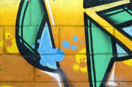 Fragment of colored street art graffiti paintings with contours and shading close up. Background...