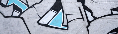 Fragment of colored street art graffiti paintings with contours and shading close up. Background texture of youth contemporary art culture. Blue and chrome colorsのeditorial素材