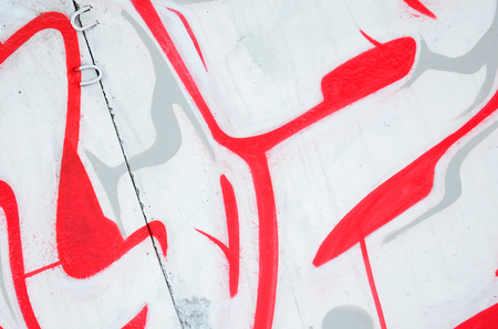 Fragment of colored street art graffiti paintings with contours and shading close up. Background texture of youth contemporary art culture. Pink red and black colorsのeditorial素材