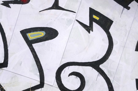 Fragment of colored street art graffiti paintings with contours and shading close up. Background texture of youth contemporary art culture. Black white and red colorsのeditorial素材