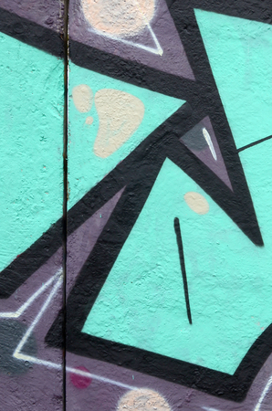 Fragment of colored street art graffiti paintings with contours and shading close up. Background texture of youth contemporary art culture. Turquoise green colorsのeditorial素材