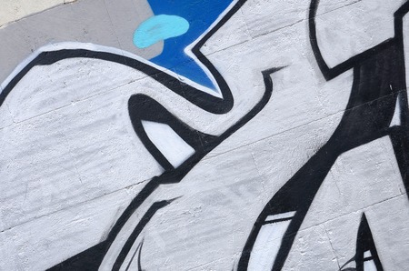 Fragment of colored street art graffiti paintings with contours and shading close up. Background texture of youth contemporary art culture. Blue and chrome colorsのeditorial素材