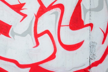 Fragment of colored street art graffiti paintings with contours and shading close up. Background texture of youth contemporary art culture. Pink red and black colorsのeditorial素材