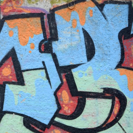 Fragment of colored street art graffiti paintings with contours and shading close up. Background texture of youth contemporary art culture. Blue orange and black colorsのeditorial素材