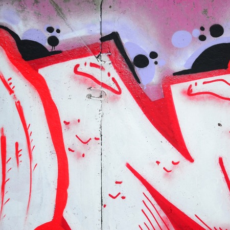Fragment of colored street art graffiti paintings with contours and shading close up. Background...