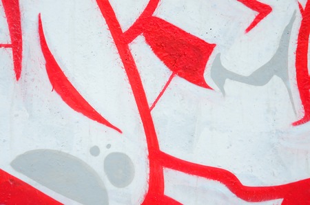 Fragment of colored street art graffiti paintings with contours and shading close up. Background texture of youth contemporary art culture. Pink red and black colorsのeditorial素材