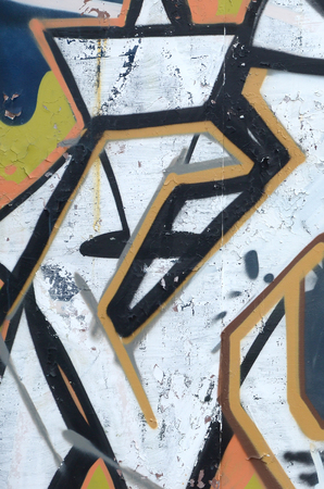 Fragment of colored street art graffiti paintings with contours and shading close up. Background texture of youth contemporary art culture. Grey and orange colorsのeditorial素材