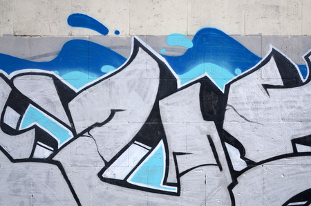 Fragment of colored street art graffiti paintings with contours and shading close up. Background texture of youth contemporary art culture. Blue and chrome colorsのeditorial素材