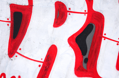 Fragment of colored street art graffiti paintings with contours and shading close up. Background texture of youth contemporary art culture. Pink red and black colorsのeditorial素材