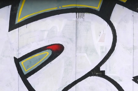 Fragment of colored street art graffiti paintings with contours and shading close up. Background texture of youth contemporary art culture. Black white and red colorsのeditorial素材