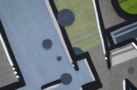 Fragment of colored street art graffiti paintings with contours and shading close up. Background texture of youth contemporary art culture. Camouflage khaki colorsのeditorial素材