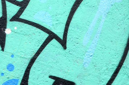 Fragment of colored street art graffiti paintings with contours and shading close up. Background texture of youth contemporary art culture. Turquoise green colorsの写真素材