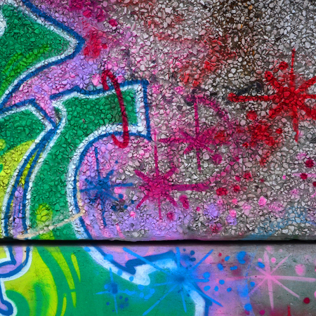 Fragment of colored street art graffiti paintings with contours and shading close up. Background texture of youth contemporary art culture. Green and yellow coloursの写真素材