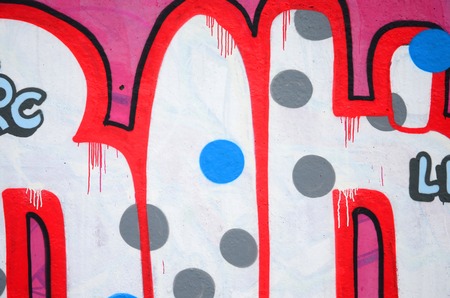 Fragment of colored street art graffiti paintings with contours and shading close up. Background...