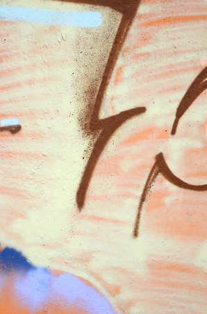 Fragment of colored street art graffiti paintings with contours and shading close up. Background texture of youth contemporary art culture. Beige brown colorsの写真素材