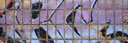 Fragment of colored street art graffiti paintings with contours and shading close up. Background texture of youth contemporary art culture. Purple and white colorsの写真素材