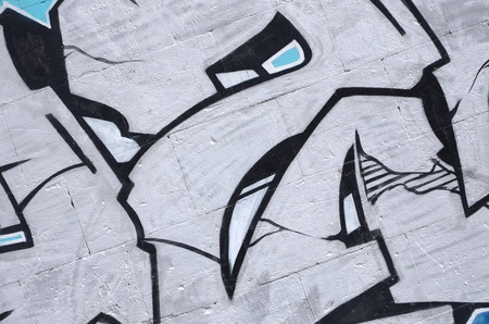 Fragment of colored street art graffiti paintings with contours and shading close up. Background texture of youth contemporary art culture. Blue and chrome colorsの写真素材