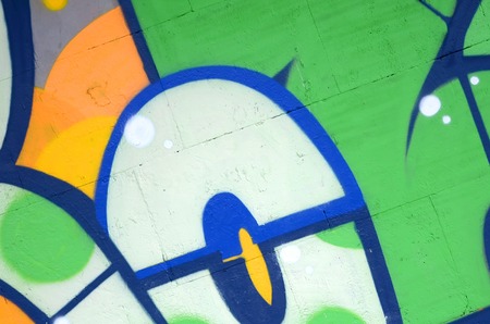 Fragment of colored street art graffiti paintings with contours and shading close up. Background...