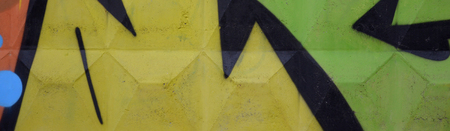 Fragment of colored street art graffiti paintings with contours and shading close up. Background texture of youth contemporary art culture. Green yellow colorsの写真素材