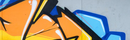 Fragment of colored street art graffiti paintings with contours and shading close up. Background...