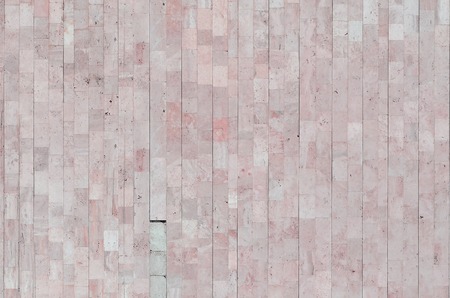 Background texture of old matte beige marble wall from a variety of large tilesの写真素材