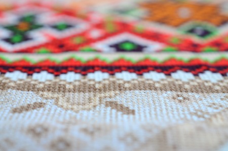Traditional Ukrainian folk art knitted embroidery pattern on textile fabric. Colored pixel design...