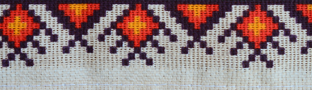 Traditional Ukrainian folk art knitted embroidery pattern on textile fabric. Colored pixel design...