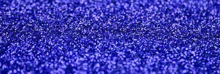 Blue decorative sequins. Background image with shiny bokeh lights from small elements that reflect...