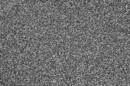 Silver decorative sequins. Background image with shiny bokeh lights from small elements that reflect lightの写真素材