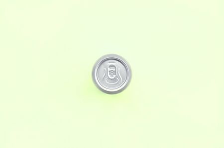 Metallic beer can on texture background of fashion pastel lime color paper in minimal concept.の写真素材