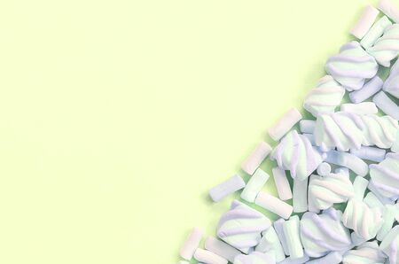 Colorful marshmallow laid out on lime paper background. pastel creative texture. minimal.の写真素材